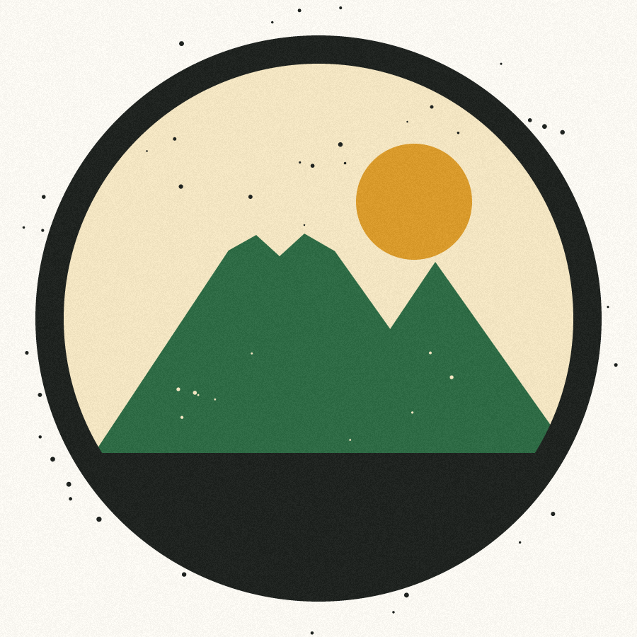 A sample badge: a circle with mountains and a sun, on paper, with dust specks and grainy edges.